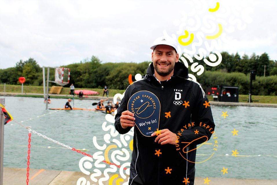 A representative of Kanusportvereinigung Havelbrüder (Berlin) holding a 'EuroKayak Experience — We're in!' sign.