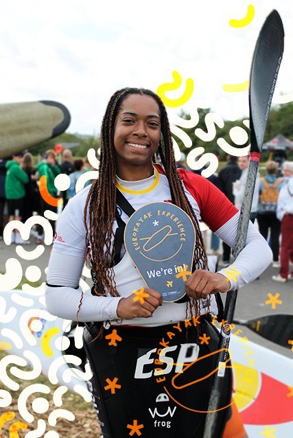 A representative of Oxio Useras holding a 'EuroKayak Experience — We're in!' sign.