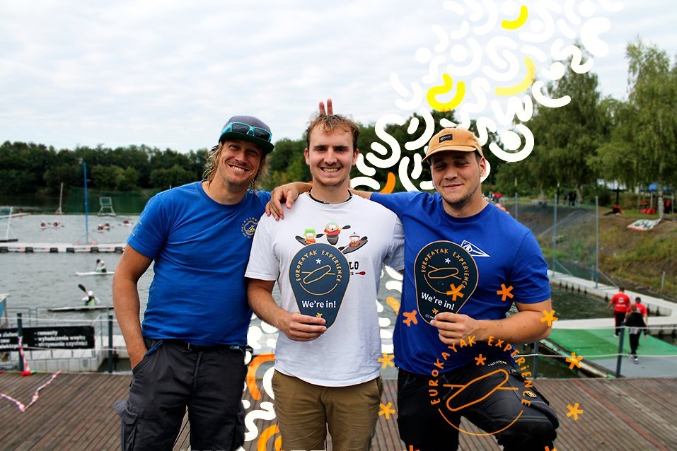 A representative of TJ Kotva Braník (Prague) holding a 'EuroKayak Experience — We're in!' sign.